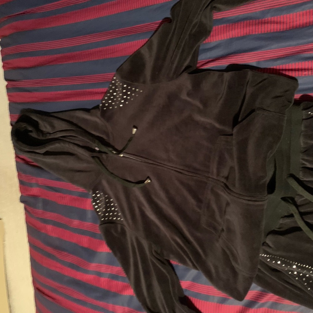 Black jacket and pants that has little rhinestones on it